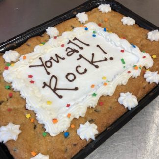 Cookie Cake with buttercream frosting and the words You all Rock!
