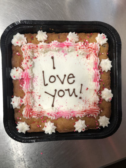 I love you written on a CookieText Cookie Cake